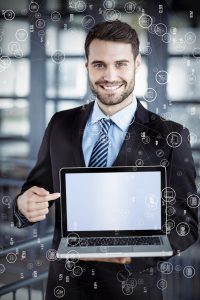 concentrated-young-businessman-is-typing-information-his-laptop-office