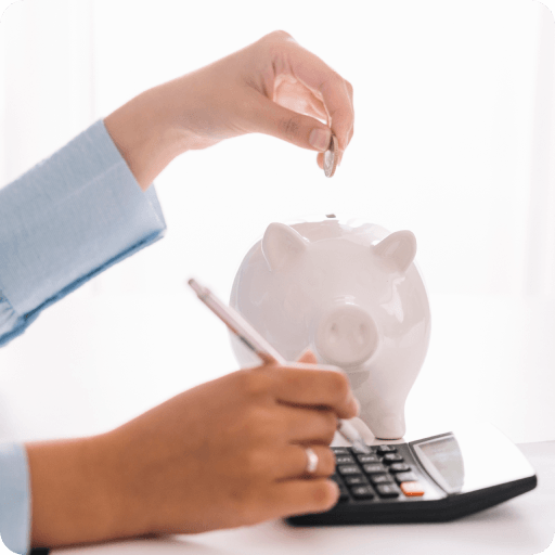 woman-s-hand-using-calculator-while-inserting-coin-piggybank 1