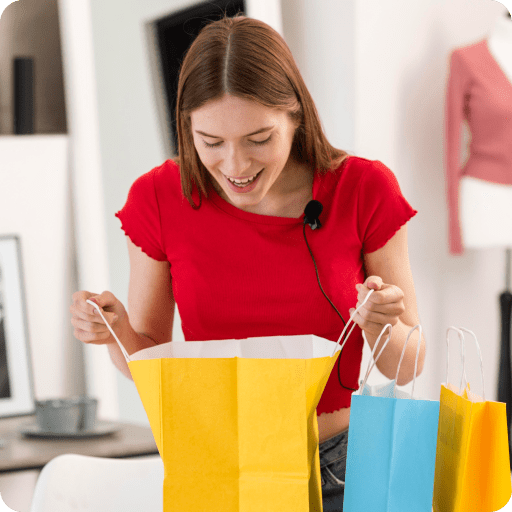 young-blogger-looking-inside-shopping-bag 1