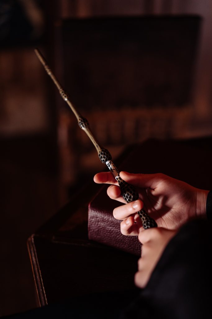 Hand holding magic wand