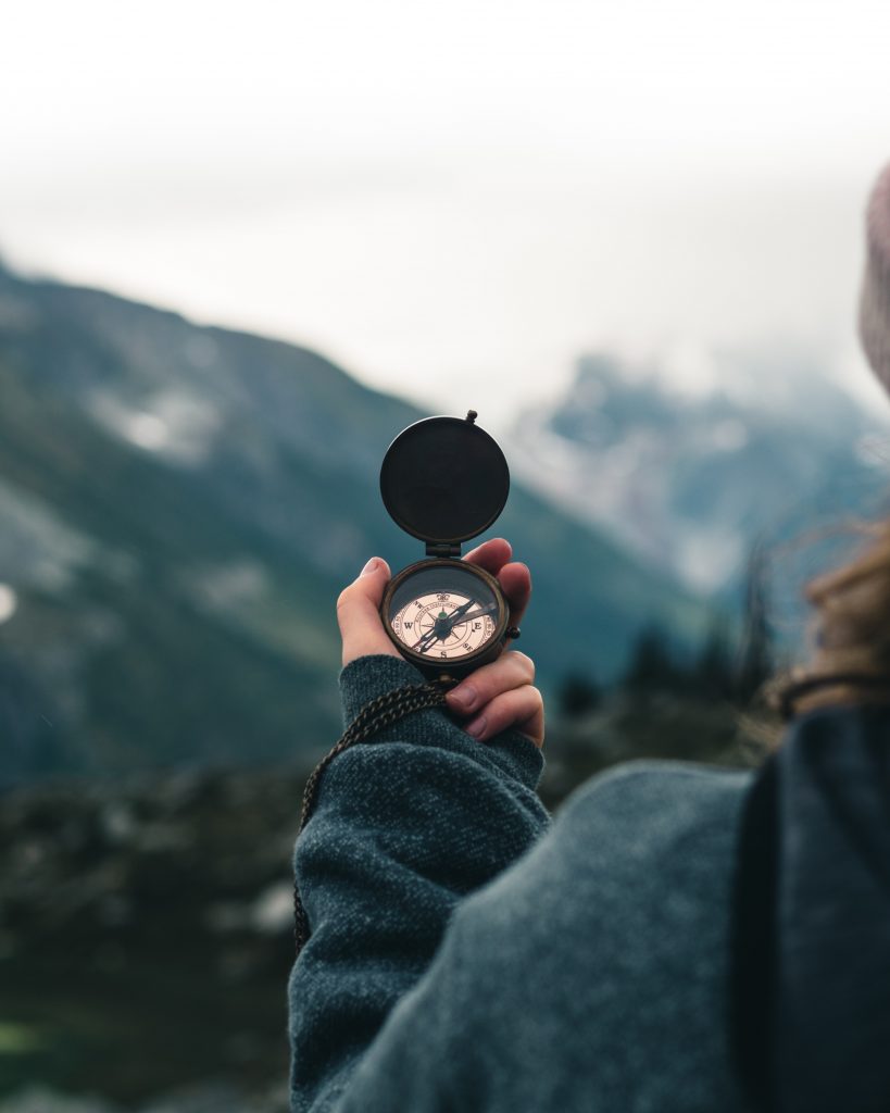 Woman holding a compass
